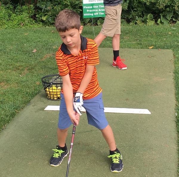 Boy at the Junior Golf Clinic at The Pines Country Club